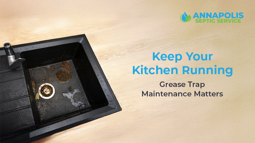 Technician performing commercial grease trap maintenance in a restaurant kitchen